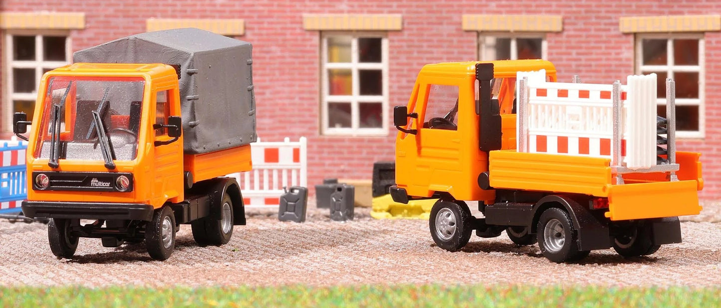 BUS42253 Multicar M26 with flatbed/tarpaulin, orange
