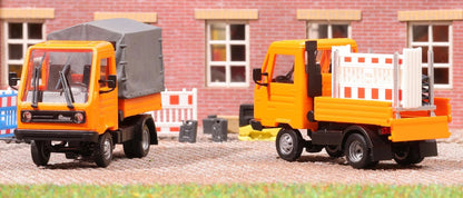 BUS42253 Multicar M26 with flatbed/tarpaulin, orange