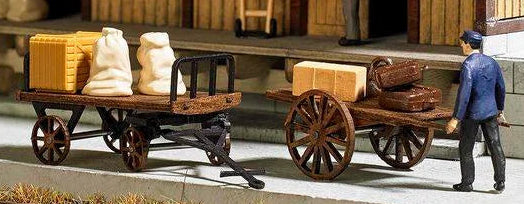 BUS1625 2 old time carts and freight items