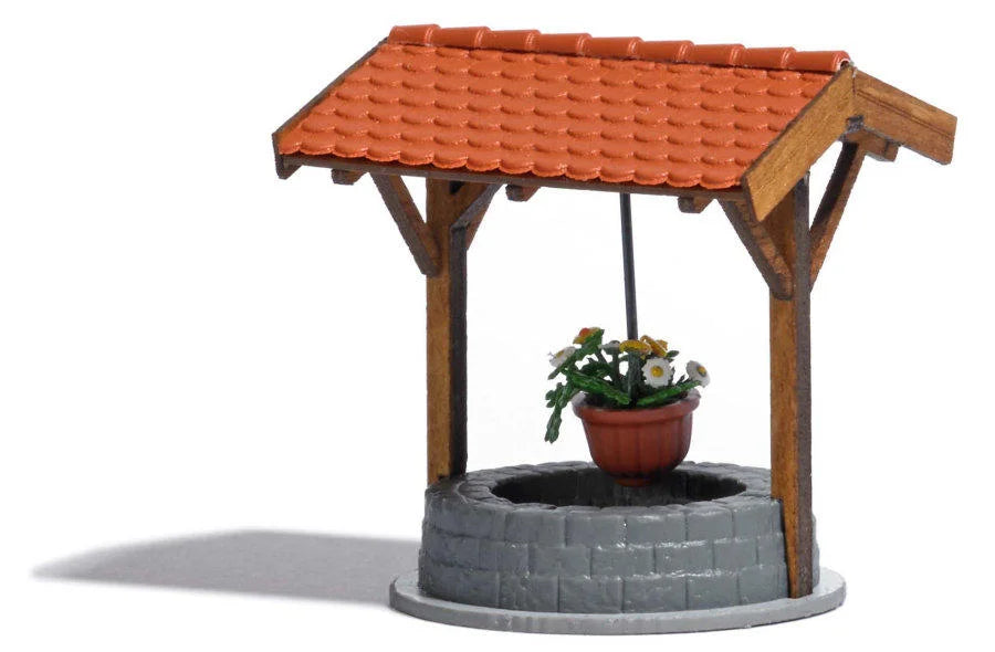 BUS1524 Old well with flower pot